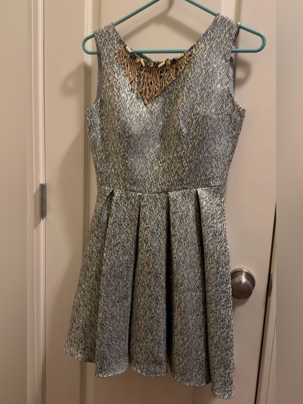 Fit and Flare with embellished neckline and bow accent on the back
